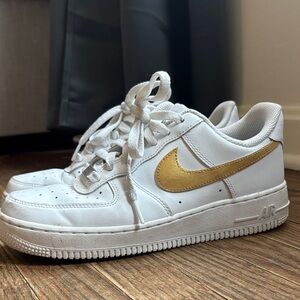 Nike White Sneakers with Gold Swoosh